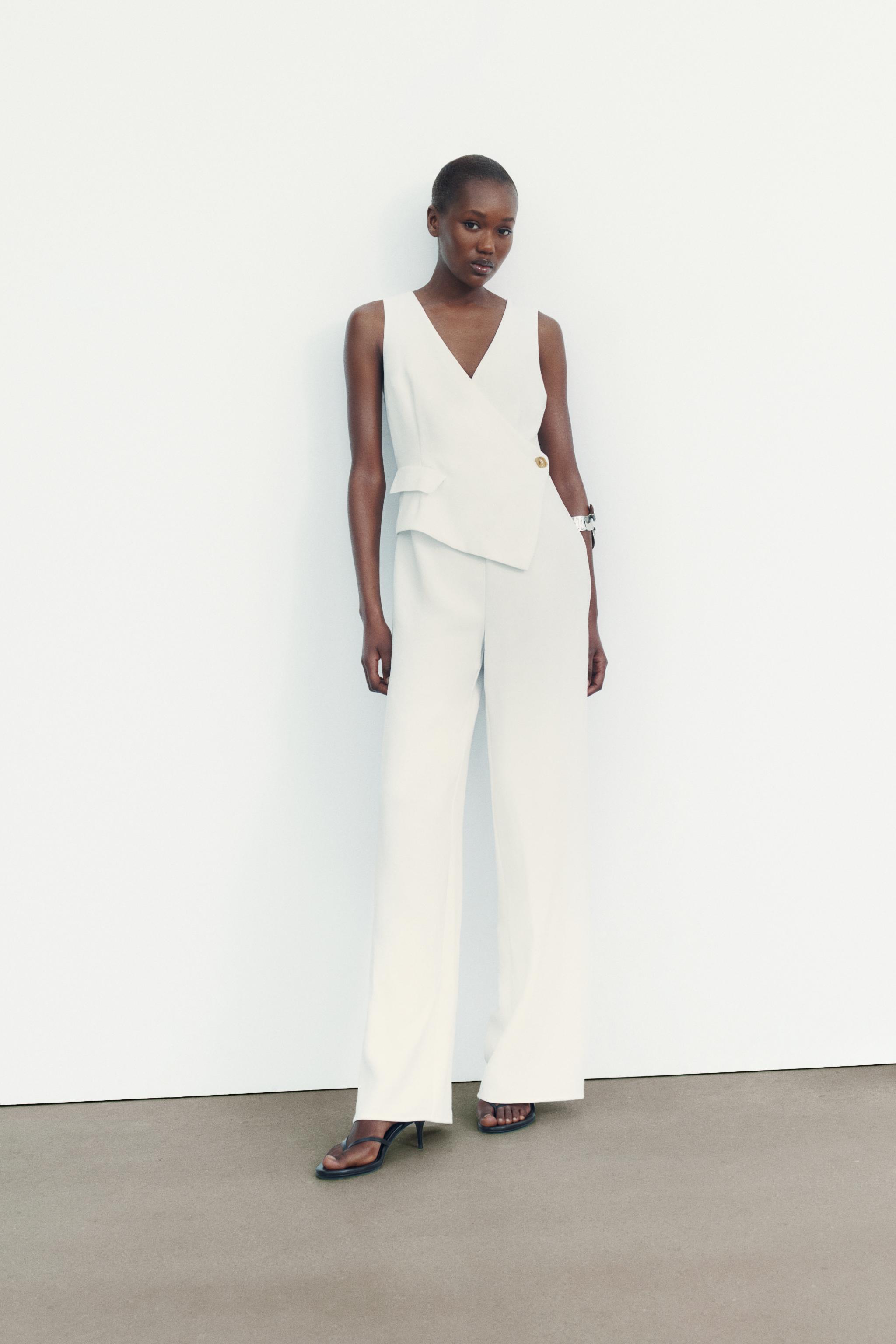 JUMPSUIT WITH ASYMMETRIC WAISTCOAT