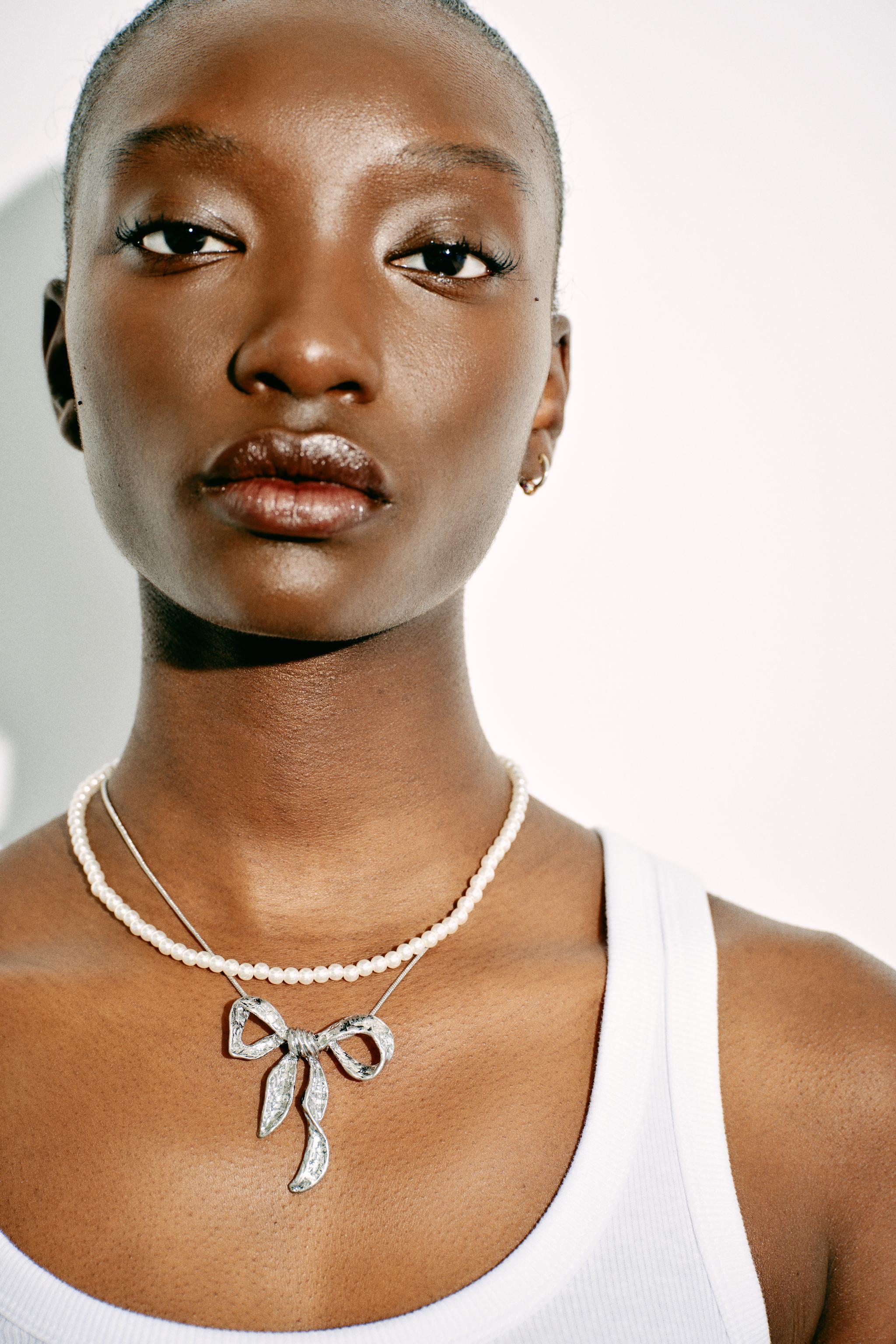 PACK OF PEARL BEAD AND BOW NECKLACES